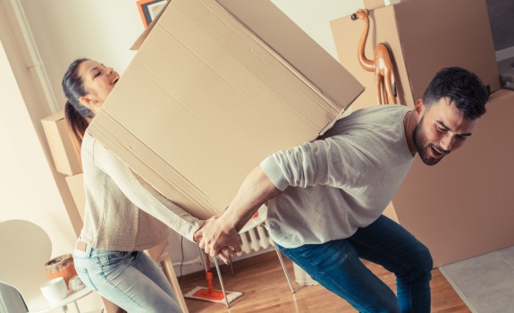 a couple with moving boxes