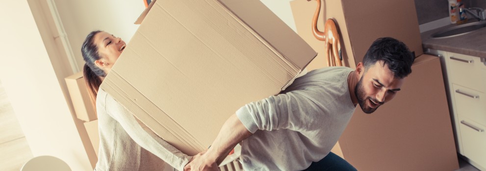 a couple with moving boxes