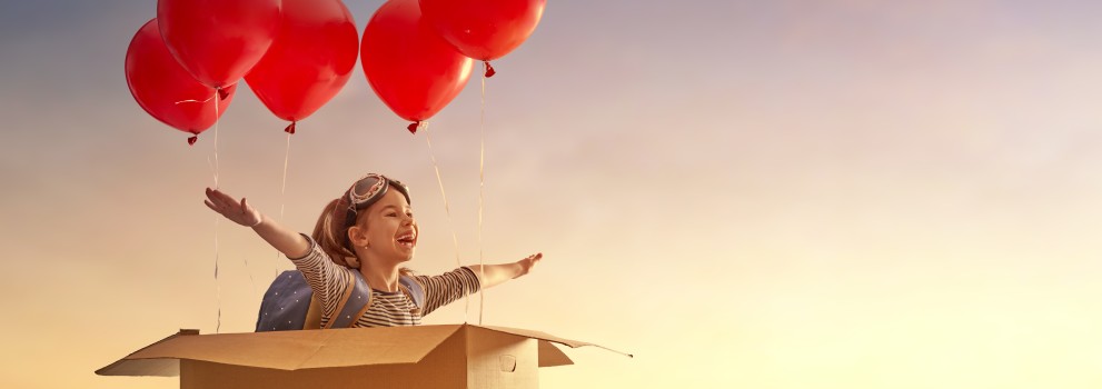 Girl flying with balloons