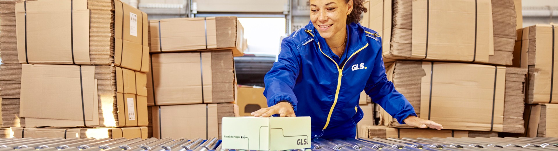 Employee in depot with parcel