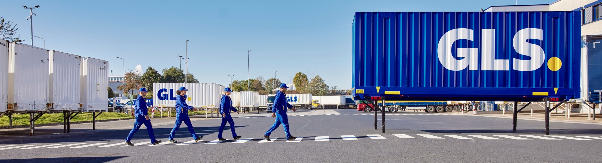 Employees outside depot with swap body