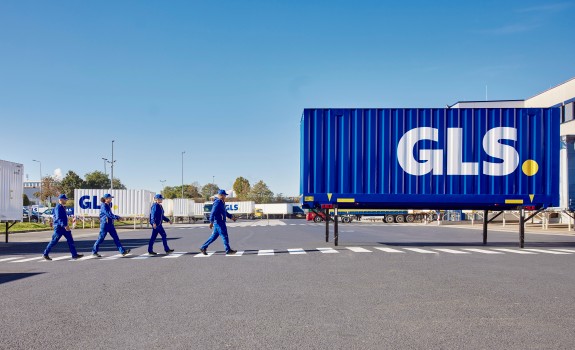 Employees outside depot with swap body