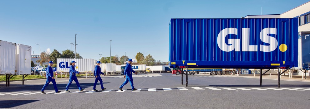 Employees outside depot with swap body