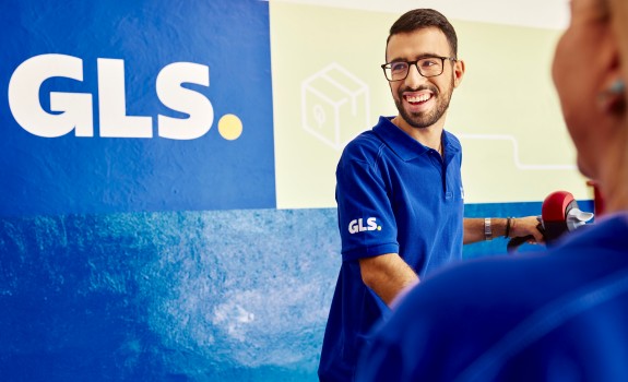 GLS employee wearing a blue polo shirt