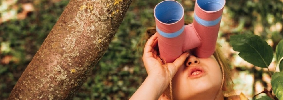 Girl with crafted binoculars