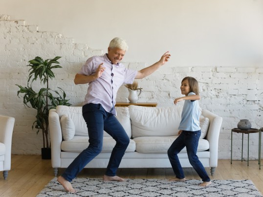 man-and-child-dancing