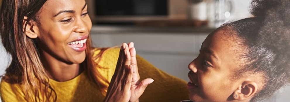 Woman and girl high five