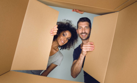 Couple looks through a box