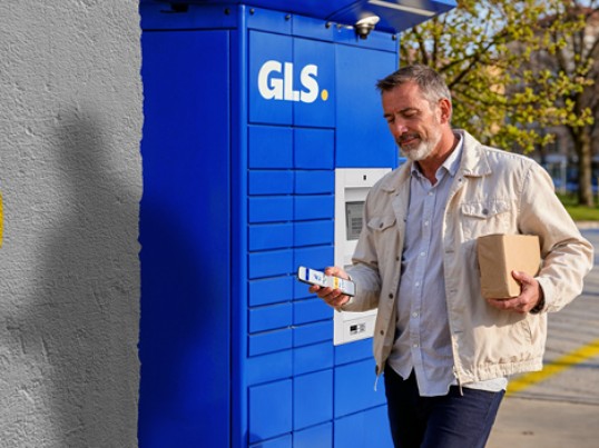 a man picking up the parcel from box