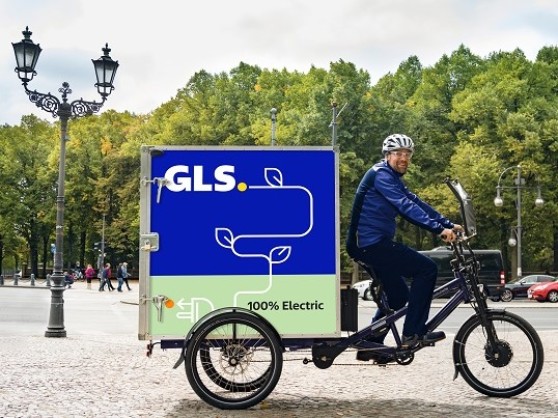  GLS delivery driver delivers parcel with an electric bike