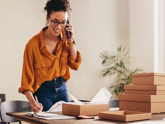 Woman with phone and parcels
