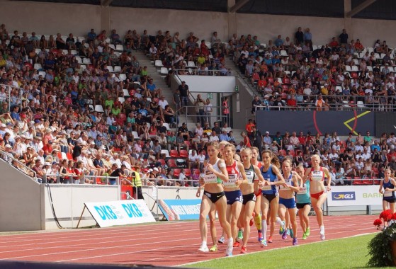 Image with athletics runners and GLS logo in the foreground