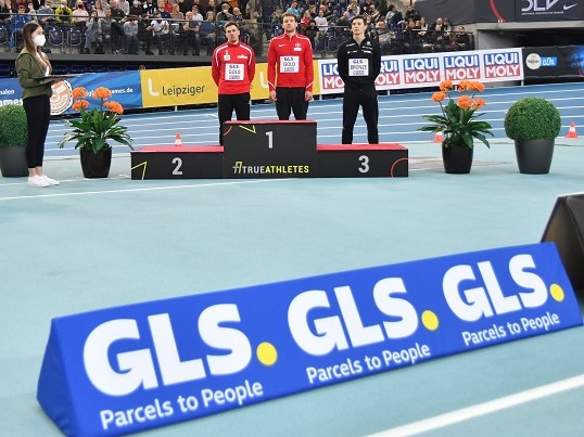 German athletics winners' ceremony with GLS logo in the foreground