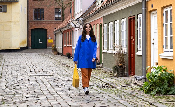 woman walking with parcel and dog