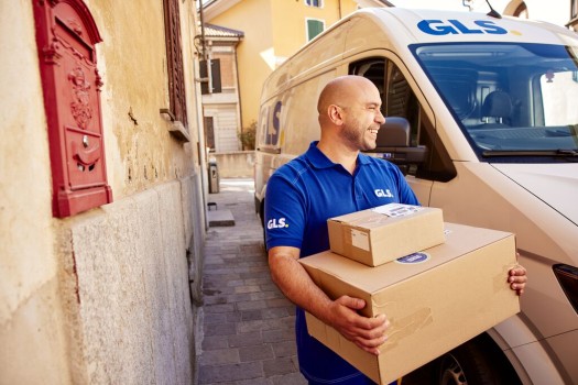Delivery man carrying GLS parcels