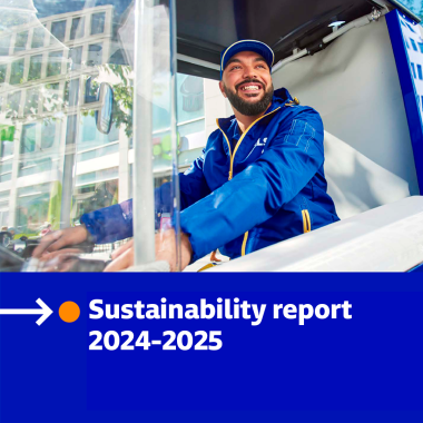 GLS courier driving a sustainable delivery vehicle in the city, image from the 2024/2025 Sustainability Report.”