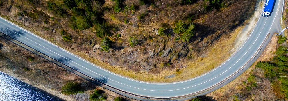 A roadside scene and a GLS truck from a bird's-eye view