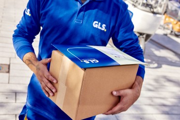 GLS employee holding a parcel