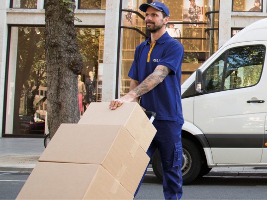 GLS France Driver unloads truck parcels