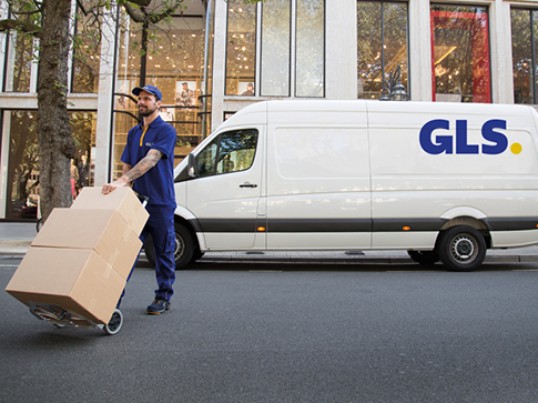Driver GLS France unloads truck parcels