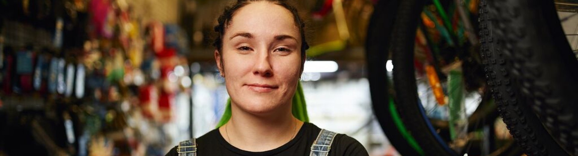 Happy_female_millennial_standing_in_gls_store