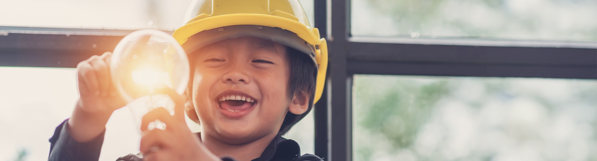 child with light bulb on