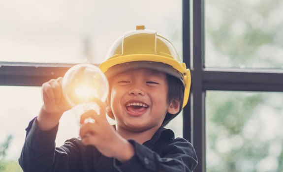 child with light bulb on