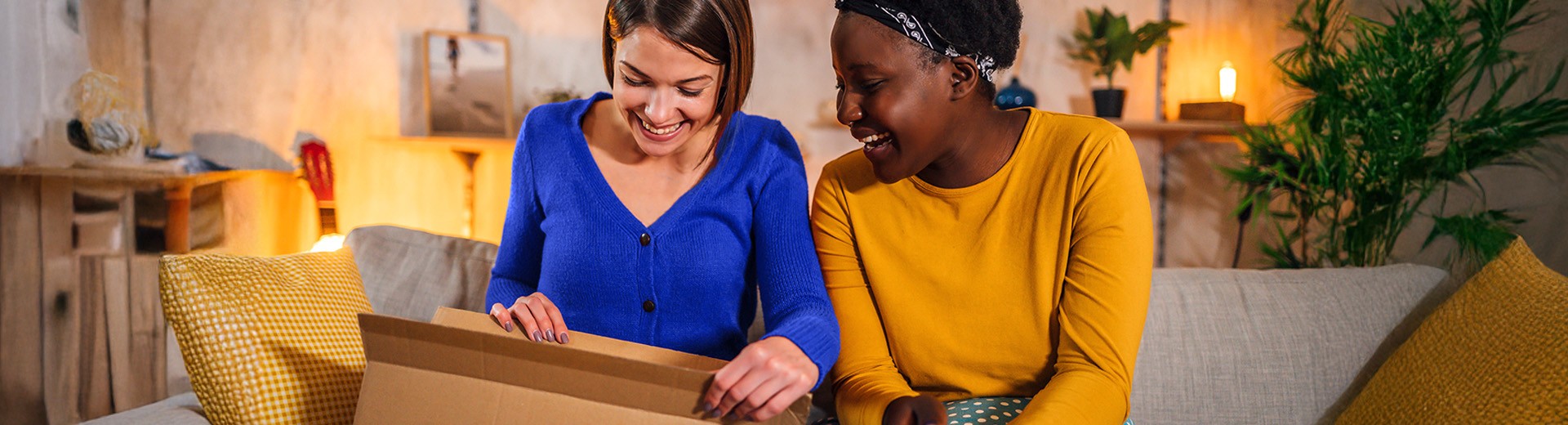 smiling consignee opens her parcel