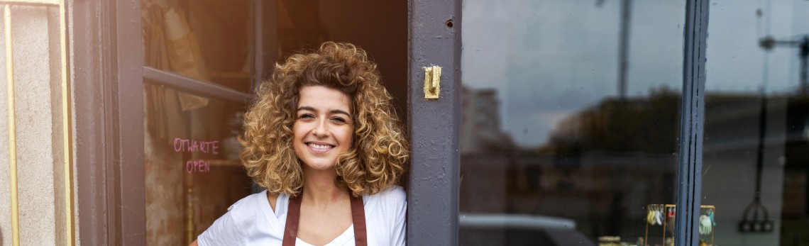 GLS business customer standing in front of her store
