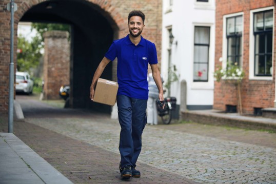 happy courier with a parcel