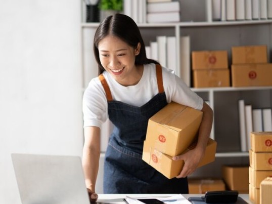 GLS private customer holding two parcels waiting for GLS printable labels