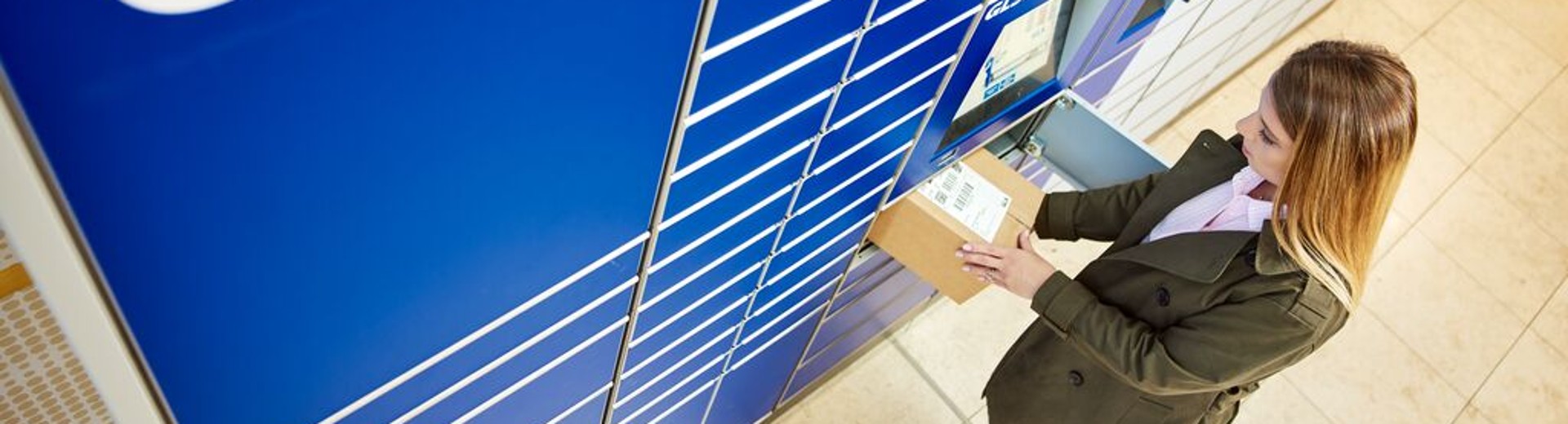 Woman in front of a GLS locker