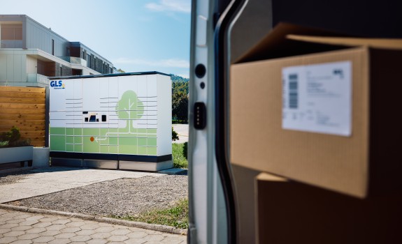 GLS Parcel locker and van with parcel in front