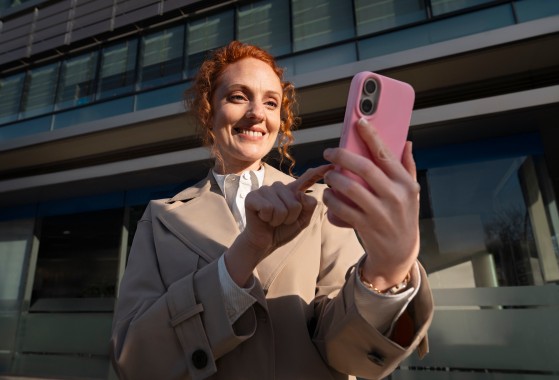 Woman on street looking at the phone